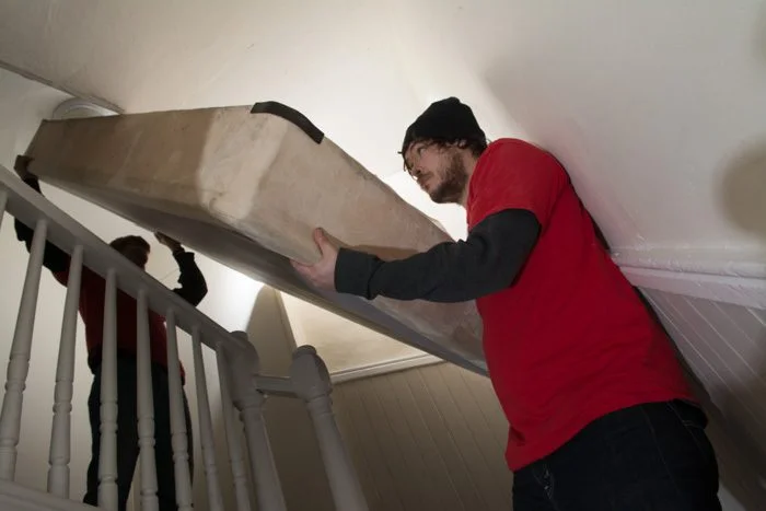 Somerville Movers - Box springs can br tricky to navigate through stairwells in urban areas.